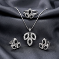 Silver leaf stone jewelry set by Zaraya Store with black marquise-cut and clear pavé stones, including necklace, ring, and earrings on dark fabric.