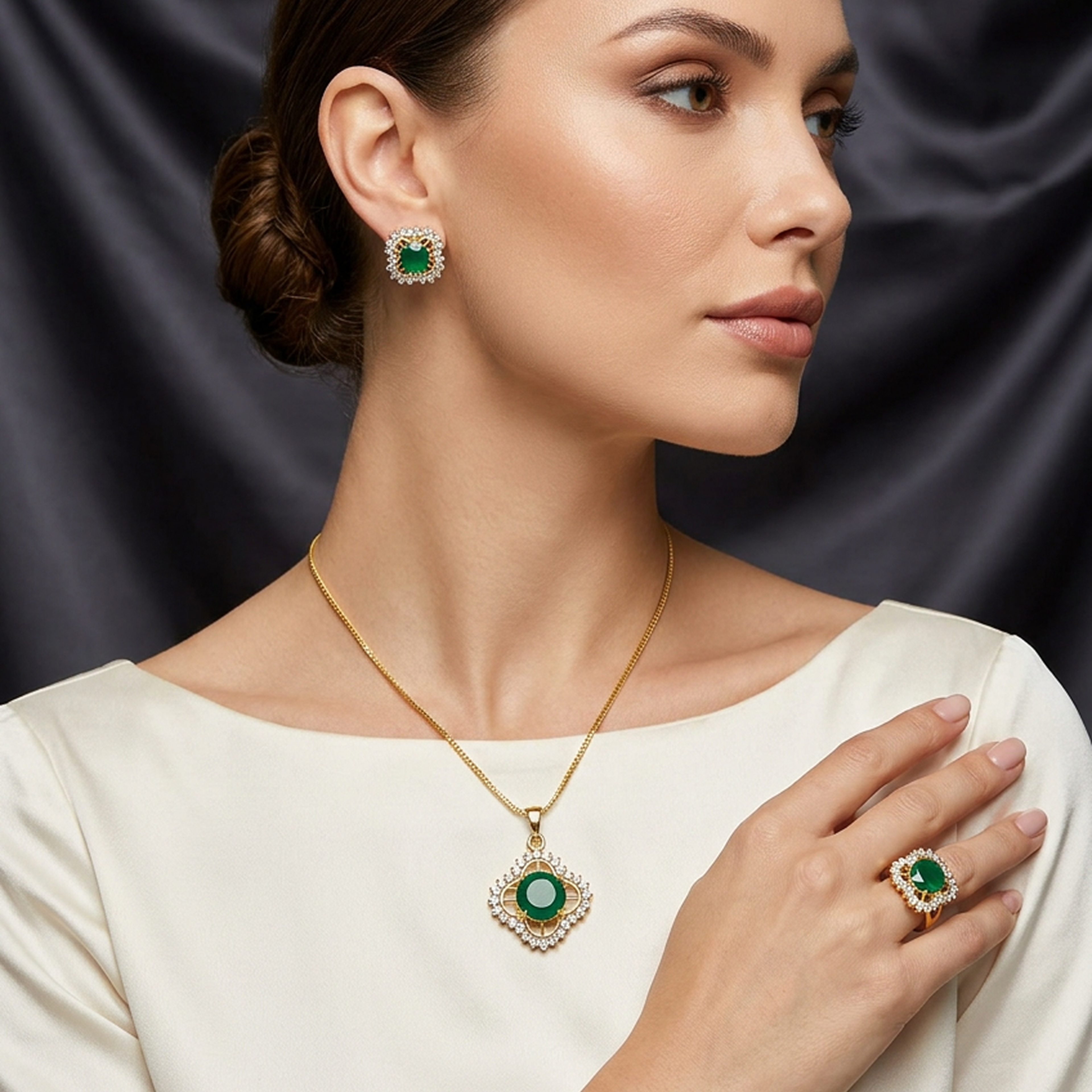Gold and green round stone jewelry set featuring ornate earrings, necklace, and ring, worn by a model.