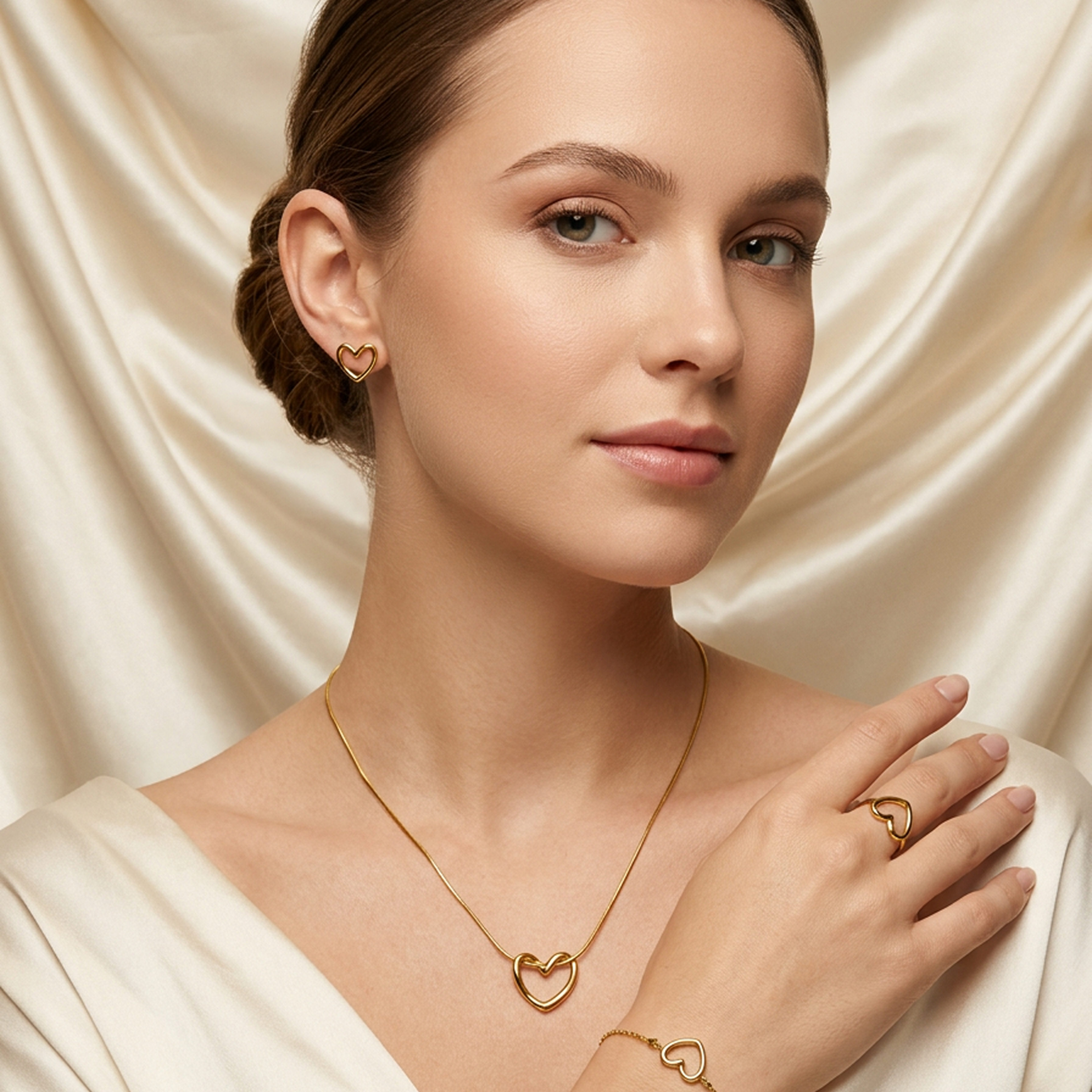 Gold open heart 4-piece jewelry set by Zaraya Store, featuring necklace, earrings, ring, and bracelet on a model.