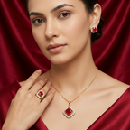 Gold-tone jewelry set featuring red round stones surrounded by white gems, including earrings, necklace, and ring, worn by a model.