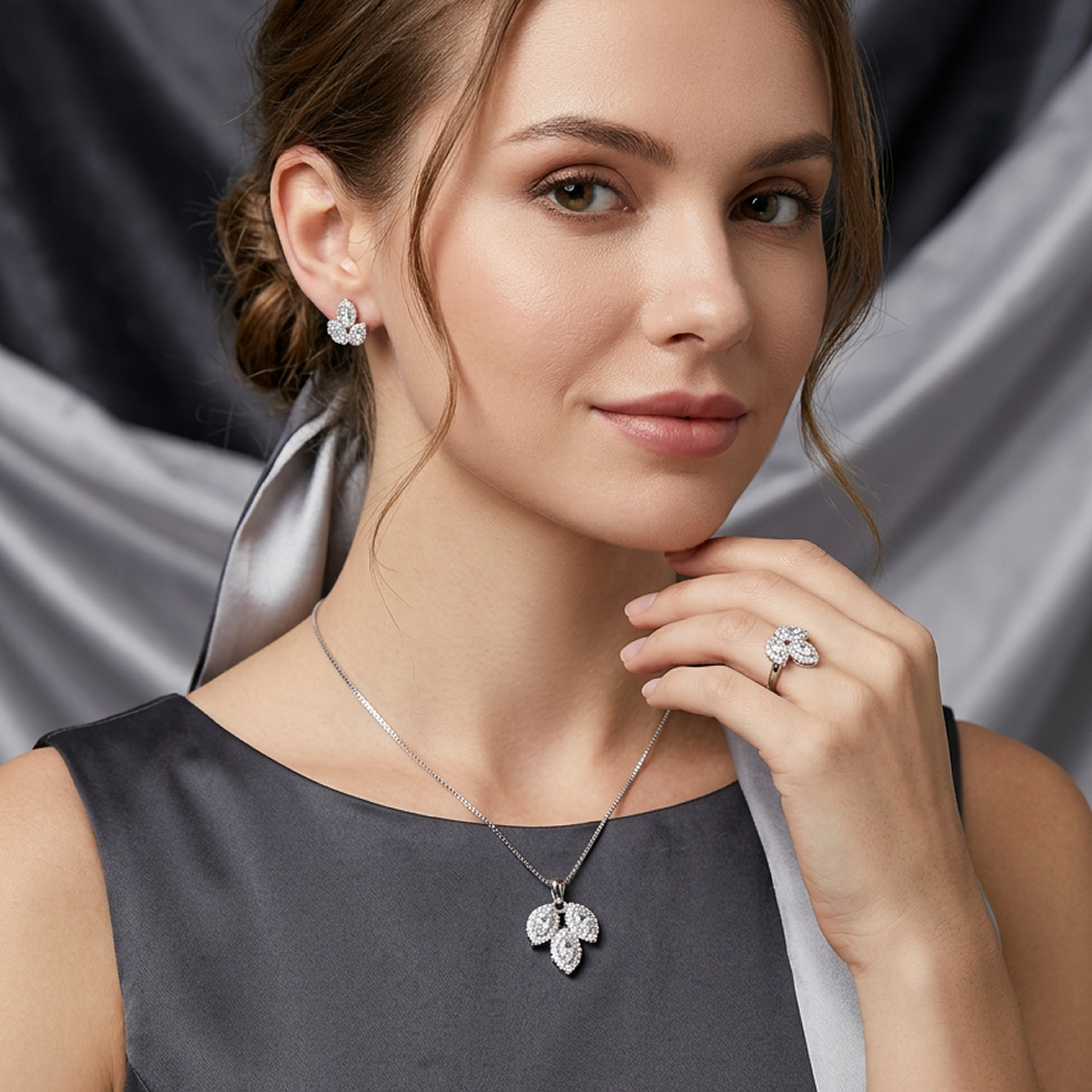 Silver leaf stone jewelry set by Zaraya Store, featuring matching necklace, ring, and earrings worn by a woman in a dark dress.