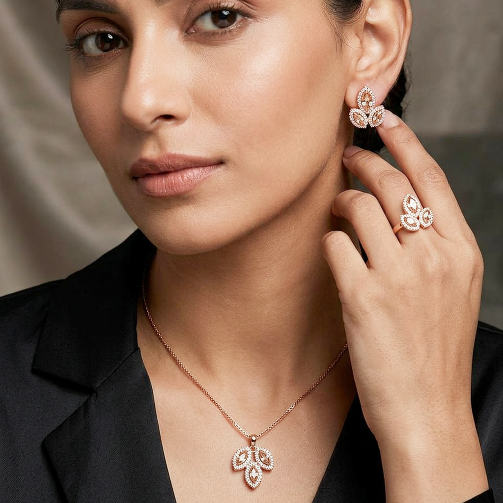 Rose gold leaf-shaped diamond jewelry set by Zaraya Store, featuring a necklace, earrings, and ring on a woman.